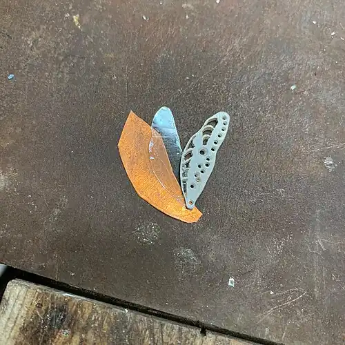 4. A sheet of copper is also cut out. It needs to be large enough to be folded on the sides of the piece.