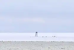 View of the remains of abandoned Izluchina Russian polar station at the northern end of Komsomolets Island