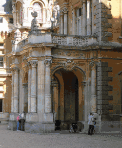 a covered entryway at the entrance of a stone building