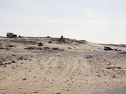 Image 8A MINURSO car (left), and a post of the Polisario Front (right) in 2017 in southern Western Sahara (from Western Sahara)