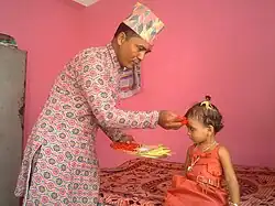 Elder Putting Dhaka Topi in Festivals