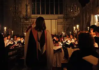 church choir singing by candlelight