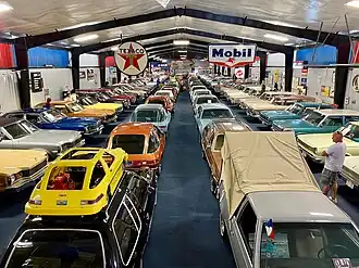 View of over 100 cars on display inside the AMC building