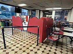 Photograph of the interior of a restaurant with seating