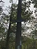 A trail marker on the north end of west rock ridge state park in Hamden Connecticut. The marker shown is for the Regicides trail, which is the main trail on the ridge.