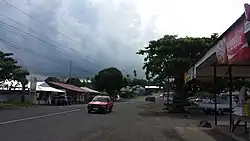 Road flanked with shops in Salelologa