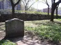 Tombstone in a grassy lawn