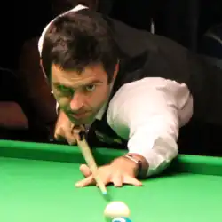 Close-up photo of Ronnie O'Sullivan lining up for a shot