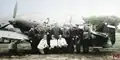 Pilots from 51st air group of the Sixth fighter regiment next to Yugoslav IK-3 fighter plane.