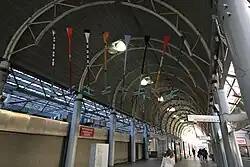 Suspended multipart sculpture by John Scott for Ruggles, Boston MA for the MBTA