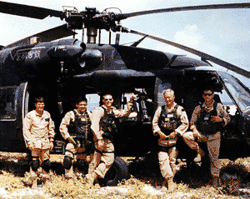 Soldiers in front of helicopter