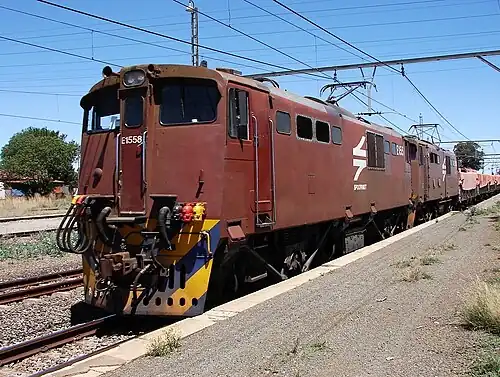 No. E1558 in an incorrect Spoornet maroon livery with "SPOORNET" at Orkney, 13 October 2009
