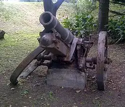 The remains of a German sFH 02 howitzer located in Kei Mouth, South Africa. It was captured from German forces in South West Africa during World War I. Like other such German weapons of the time, it was cast with the markings R II Ultima Ratio Regum ("last argument of kings").