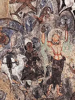 Sab leading the way to a trader with a camel.