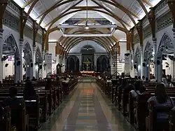 Church nave in 2023, showing Neo-Gothic motif windows