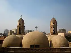 Coptic church with distinctive domes and traditional Egyptian Christian architecture