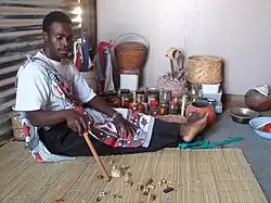 Image 9Traditional healer of South Africa performing a divination by reading the bones. Credit: User:FastilyClone (Fastily) For more about this picture, see Divination in Traditional African religions and African divination