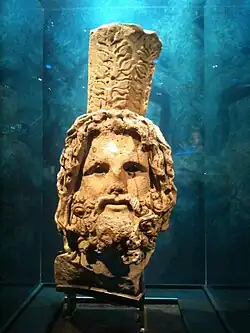 Head of Serapis, bearded, wearing a calathus