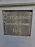 Plaque at Castlegregory National School, County Kerry; dated 1843, it is among the earliest National Schools.