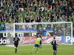 A group of players on a grass pitch