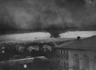 Elevated photograph of a distant tornado