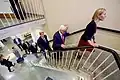 Secretary of State John Kerry climbs up the stairs of the building