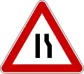 Road narrows on right side
