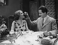 Hanna Rozwadowska as Jadwiga Barczyńska and Zbigniew Sawan as Henryk Barczyński in a scene from Serce na ulicy