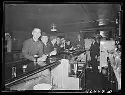 Dick's images of Pennsylvania mining towns, including this one of a bar in Gilberton (also dated "1938?"), focus on everyday activities, household living and items, and the mines themselves.