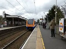 A London Overground train approaching the northbound platform at Silver Street Station