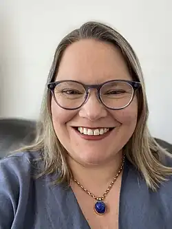 Headshot of Leachman smiling