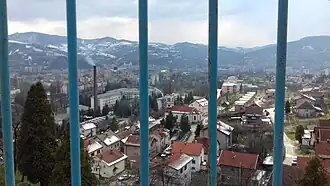 Winter cityscape view from the road to Smetovi, church and hospital in the foreground