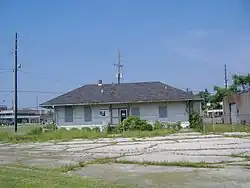 Front of depot, before restoration. Sign in door states that the depot is owned by the state of Indiana, and that trespassers will be prosecuted.