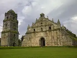 Old, mossy church with a lawn in front