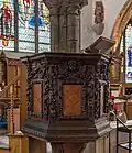 The pulpit, with wood carving detail