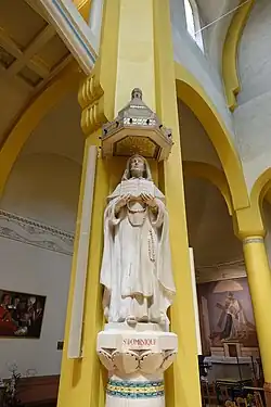 Statue of St. Dominique carrying her book and rosary, by C. Debert,
