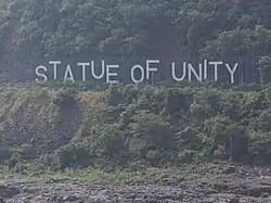 Statue of Unity's signboard across the river