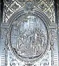 One of the reliefs on the door of the Palais Equitable illustrating the legend of the Stock im Eisen