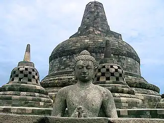 Buddha in the exposed stupa of Borobudur mandala, Central Java, Indonesia, c. 825.