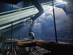 Sun shining into the empty asphalt barge Endeavour while under repair in Muskegon, Michigan