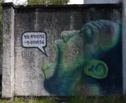 Graffiti of a human face speaking numbers