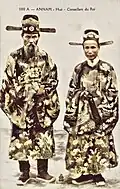 Tôn Thất Hân (left) and Nguyễn Hữu Bài in court dress, 1910s.