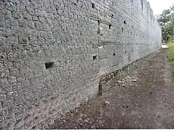 Rebuilding the north wall on the outside.