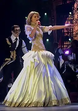 Swift in a Victorian white gown