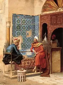 Image 33Chess game between Tha'ālibī and Bākhazarī, 1896 painting by Ludwig Deutsch (from History of chess)
