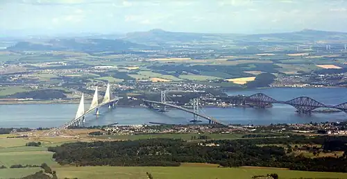 From left to right The Queensferry Crossing, the Forth Road Bridge and the Forth Bridge. South Queensferry is in the foreground.