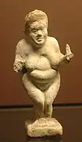Statuette of a heavier woman showing changing ideals of body weight.