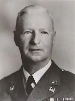 Black-and-white head shot of Robins