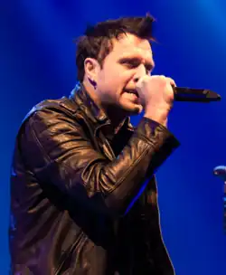 Walst performing with Three Days Grace in 2015