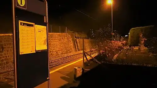 Board displaying timetable on station platform